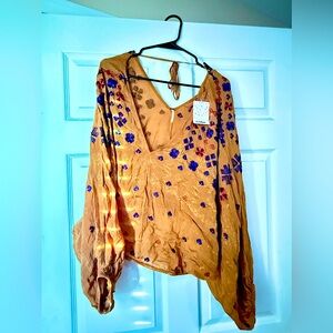 Free People top never worn tags still attached.